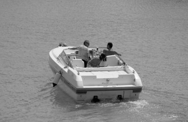 Italy, Sicily, Mediterranean Sea, Marina di Ragusa (Ragusa Province); 22 August 2022, people on a luxury yacht in the port - EDITORIAL