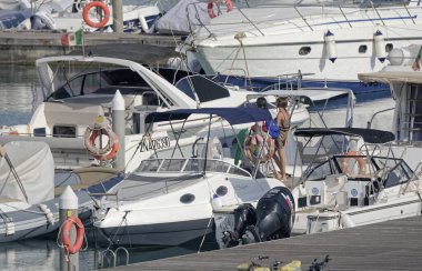 Italy, Sicily, Mediterranean sea, Marina di Ragusa (Ragusa Province); 23 August 2022, people and luxury yachts in the port - EDITORIAL