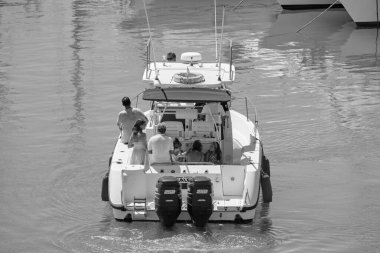 Italy, Sicily, Mediterranean Sea, Marina di Ragusa (Ragusa Province); 25 August 2022, people on a luxury yacht in the port - EDITORIAL