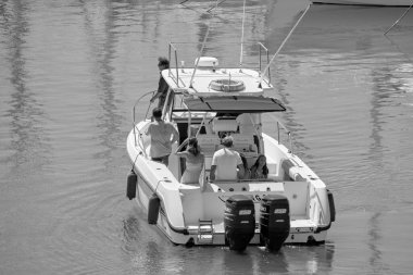 Italy, Sicily, Mediterranean Sea, Marina di Ragusa (Ragusa Province); 25 August 2022, people on a luxury yacht in the port - EDITORIAL