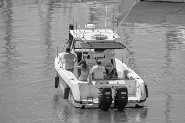 Italy, Sicily, Mediterranean Sea, Marina di Ragusa (Ragusa Province); 25 August 2022, people on a luxury yacht in the port - EDITORIAL