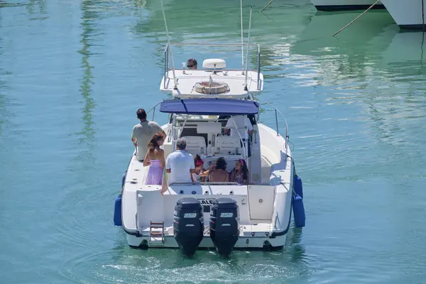 Italy, Sicily, Mediterranean Sea, Marina di Ragusa (Ragusa Province); 25 August 2022, people on a luxury yacht in the port - EDITORIAL