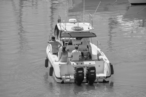 Italy, Sicily, Mediterranean Sea, Marina di Ragusa (Ragusa Province); 25 August 2022, people on a luxury yacht in the port - EDITORIAL