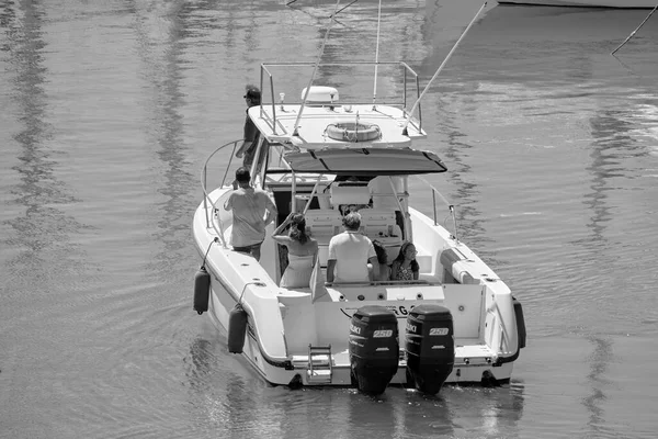 Italy, Sicily, Mediterranean Sea, Marina di Ragusa (Ragusa Province); 25 August 2022, people on a luxury yacht in the port - EDITORIAL