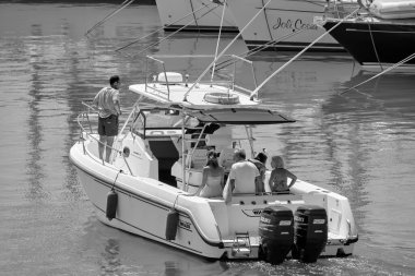 Italy, Sicily, Mediterranean Sea, Marina di Ragusa (Ragusa Province); 25 August 2022, people on a luxury yacht in the port - EDITORIAL