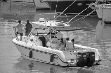Italy, Sicily, Mediterranean Sea, Marina di Ragusa (Ragusa Province); 25 August 2022, people on a luxury yacht in the port - EDITORIAL