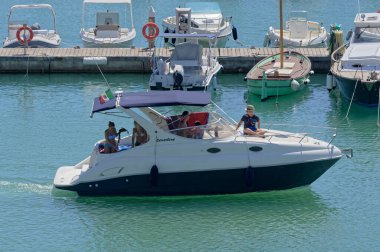 Italy, Sicily, Mediterranean Sea, Marina di Ragusa (Ragusa Province); 27 August 2022, people on a luxury yacht in the port - EDITORIAL