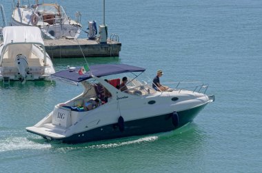 Italy, Sicily, Mediterranean Sea, Marina di Ragusa (Ragusa Province); 27 August 2022, people on a luxury yacht in the port - EDITORIAL