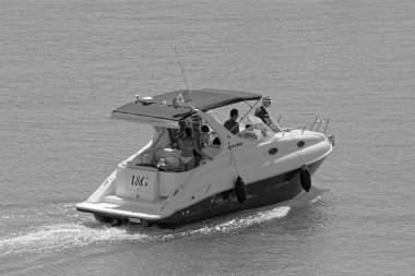 Italy, Sicily, Mediterranean Sea, Marina di Ragusa (Ragusa Province); 27 August 2022, people on a luxury yacht in the port - EDITORIAL