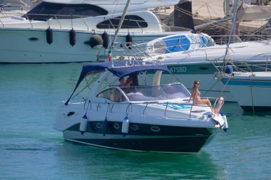 Italy, Sicily, Mediterranean Sea, Marina di Ragusa (Ragusa Province); 28 August 2022, people on a luxury yacht in the port - EDITORIAL