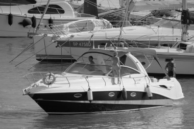 Italy, Sicily, Mediterranean Sea, Marina di Ragusa (Ragusa Province); 28 August 2022, people on a luxury yacht in the port - EDITORIAL