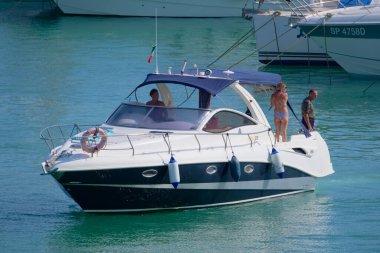 Italy, Sicily, Mediterranean Sea, Marina di Ragusa (Ragusa Province); 28 August 2022, people on a luxury yacht in the port - EDITORIAL