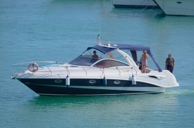 Italy, Sicily, Mediterranean Sea, Marina di Ragusa (Ragusa Province); 28 August 2022, people on a luxury yacht in the port - EDITORIAL