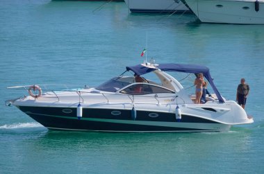 Italy, Sicily, Mediterranean Sea, Marina di Ragusa (Ragusa Province); 28 August 2022, people on a luxury yacht in the port - EDITORIAL