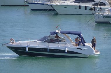 Italy, Sicily, Mediterranean Sea, Marina di Ragusa (Ragusa Province); 28 August 2022, people on a luxury yacht in the port - EDITORIAL