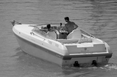 Italy, Sicily, Mediterranean Sea, Marina di Ragusa (Ragusa Province); 4 September 2022, couple on a luxury yacht in the port - EDITORIAL