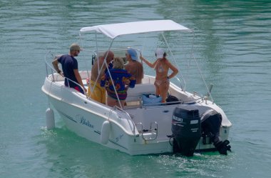 Italy, Sicily, Mediterranean Sea, Marina di Ragusa (Ragusa Province); 4 September 2022, people on a motor boat in the port - EDITORIAL