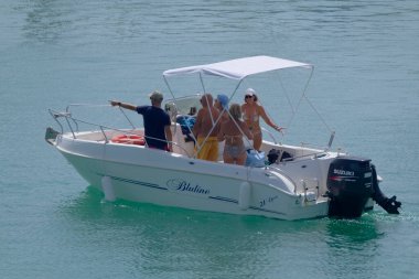 Italy, Sicily, Mediterranean Sea, Marina di Ragusa (Ragusa Province); 4 September 2022, people on a motor boat in the port - EDITORIAL