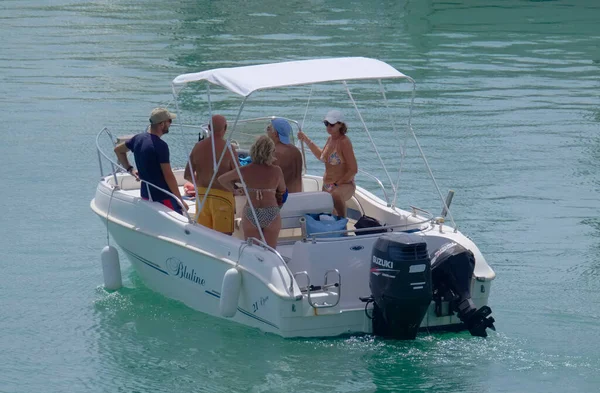 Italy, Sicily, Mediterranean Sea, Marina di Ragusa (Ragusa Province); 4 September 2022, people on a motor boat in the port - EDITORIAL