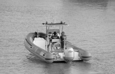 Italy, Sicily, Mediterranean Sea, Marina di Ragusa (Ragusa Province); 4 September 2022, men on a rubber boat in the port - EDITORIAL