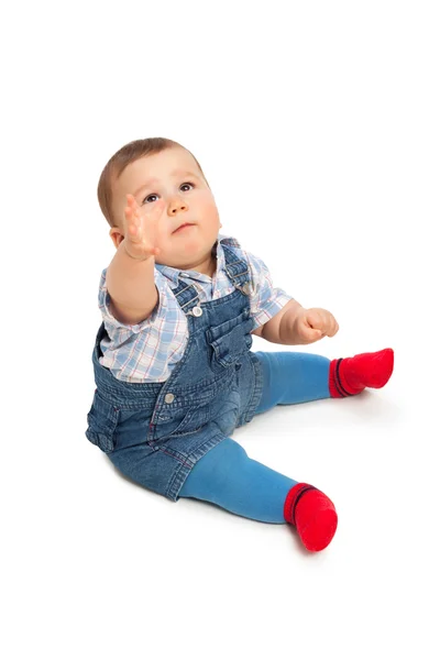 Niedliche kleine Junge auf einem weißen — Stockfoto