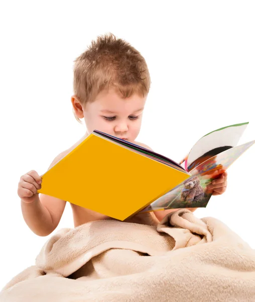 Small child plays under beige towel — Stock Photo, Image