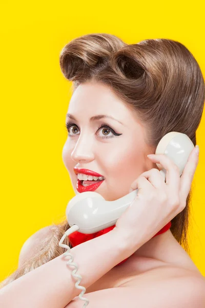 Pin-up girl talking on retro telephone — Stock Photo, Image