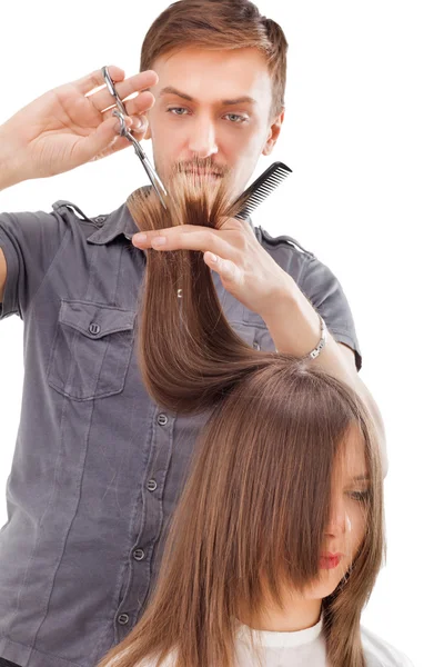 Professional hairdresser with long hair model Royalty Free Stock Images