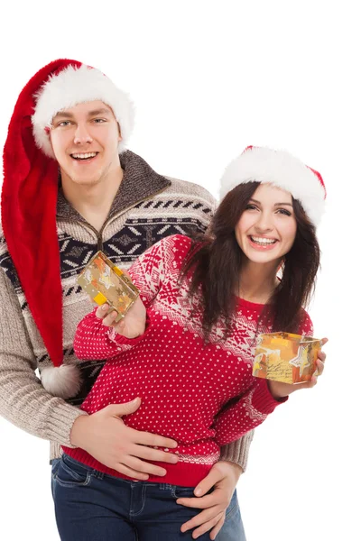 Young happy couple near a Christmas tree. — Stock Photo, Image