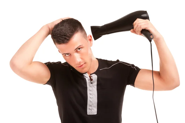 Homme avec un sèche-cheveux — Photo