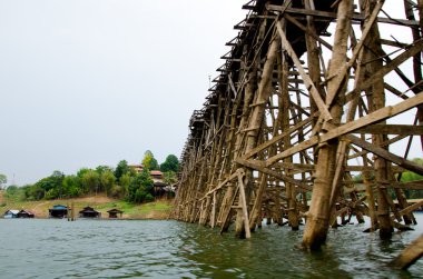 Cityscape of wooden bridge at Sangklaburi in Kanchanaburi, Thail clipart