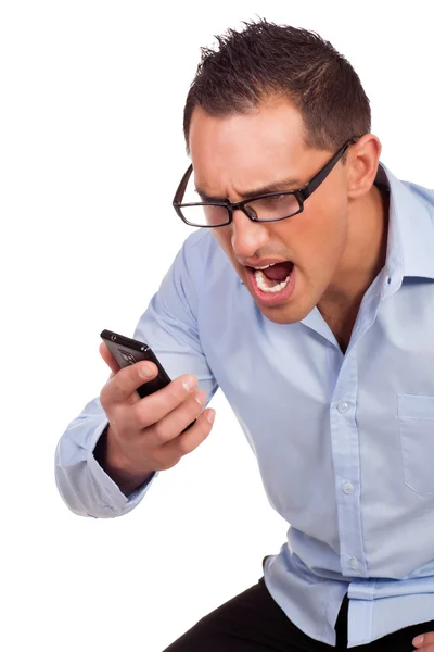 Young man shouts at his mobile phone — Stock Photo, Image