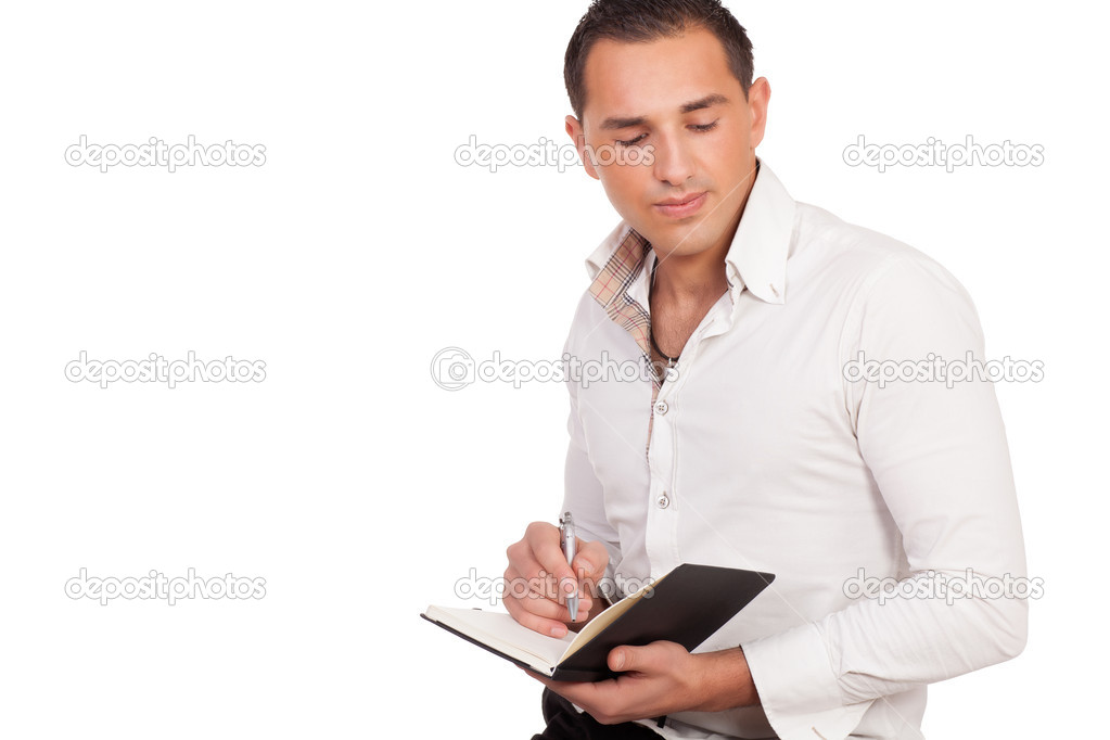 Young man making notes