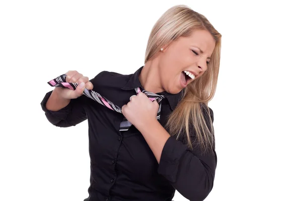 Furious woman ripping off her tie — Stock Photo, Image