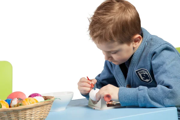 Young boy decorating Easter eggs — Stock Photo, Image