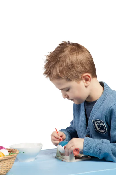 Little boy painting eggs — Stock Photo, Image