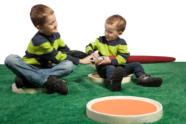 Young boys with big brush sitting in color palette — Stock Photo, Image