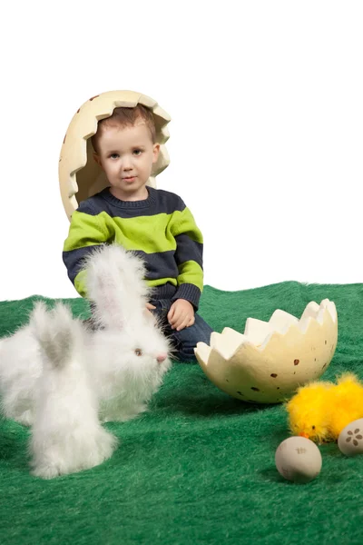 Small boy with toy bunnies, chicks and eggs — Stock Photo, Image