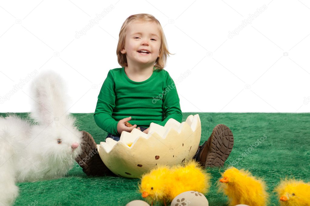 Cute young girl with toy bunny and chicks