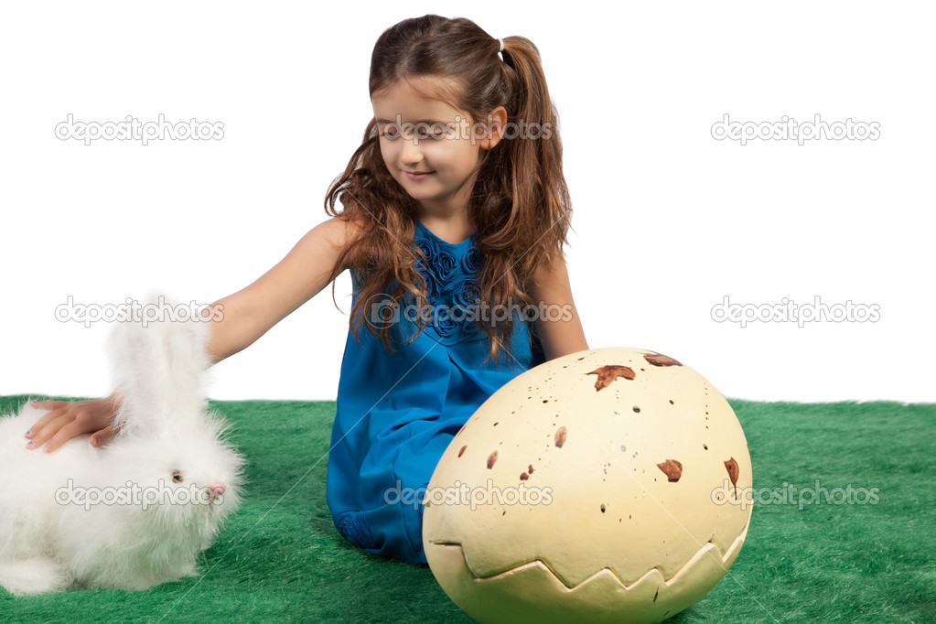 Young girl with a huge egg shape and toy bunny
