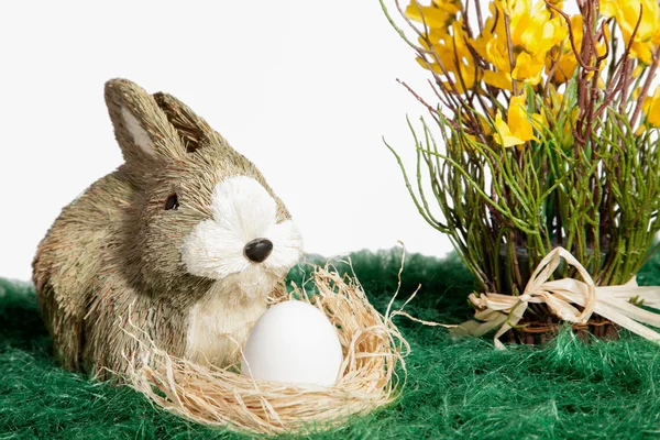 Brown and white ornament rabbit with egg — Stock Photo, Image