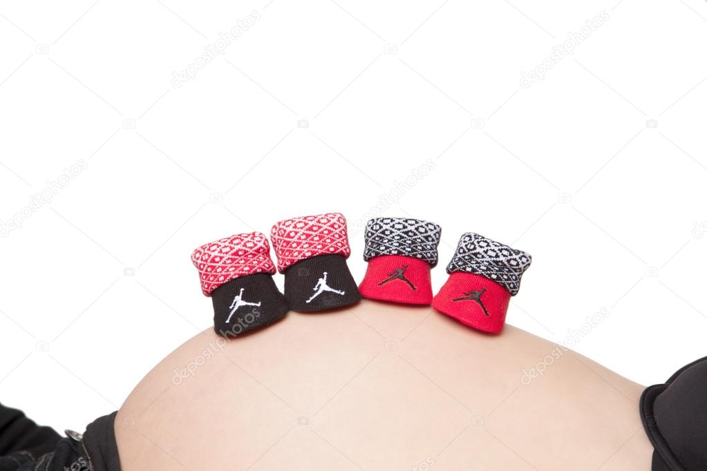 Pregnant belly with baby booties