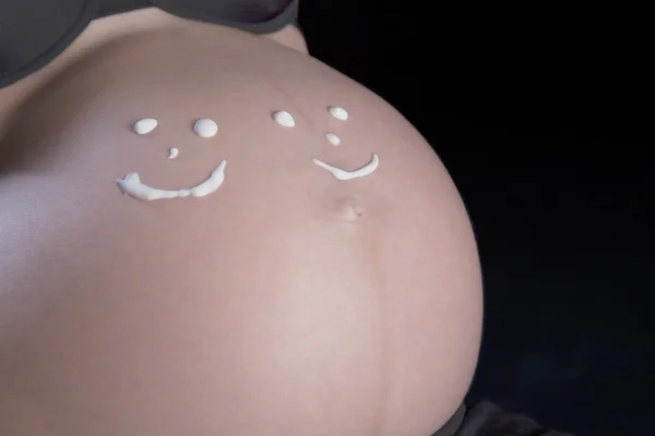 Pregnant woman with smiley faces — Stock Photo, Image