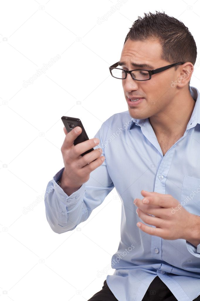 Upset man reading a message on his mobile