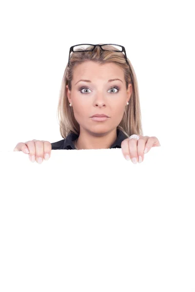 Surprised woman holding a blank sign — Stock Photo, Image