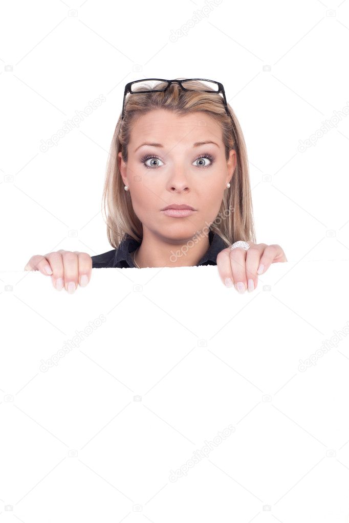 Surprised woman holding a blank sign