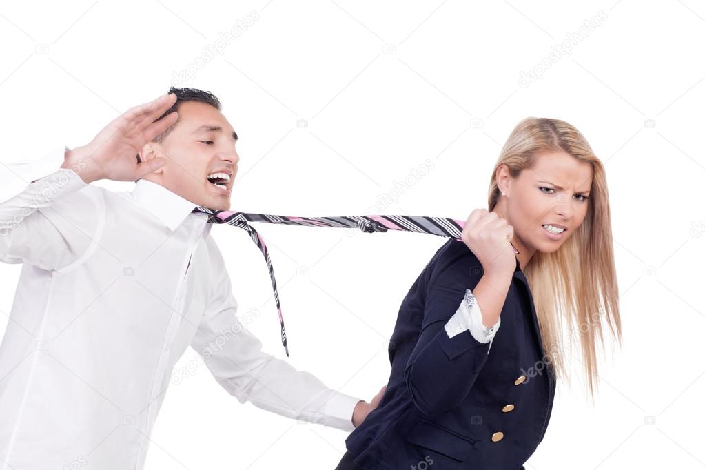 Woman pulling a man by his tie