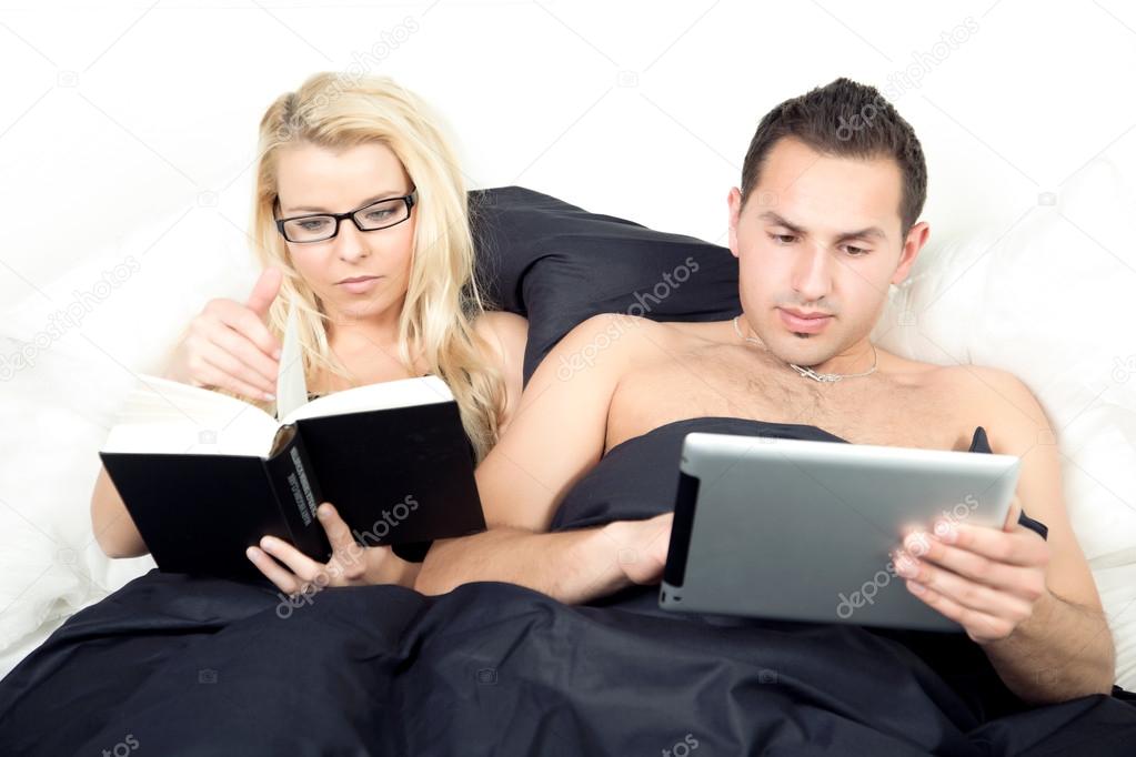 Married couple reading before sleeping