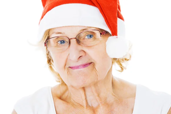 Donna anziana che indossa il cappello di Babbo Natale su sfondo bianco — Foto Stock