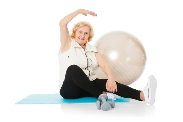 Senior Woman Doing Stretching Exercise On Mat — Stock Photo, Image